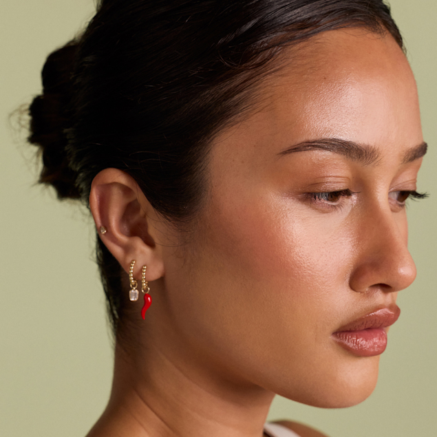 womans curated ear with various earring styles