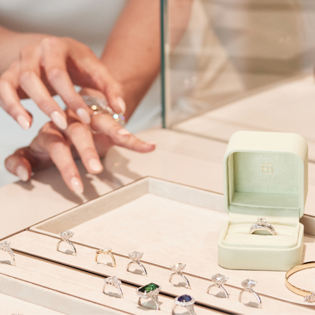 hand with various style engagement ring bands